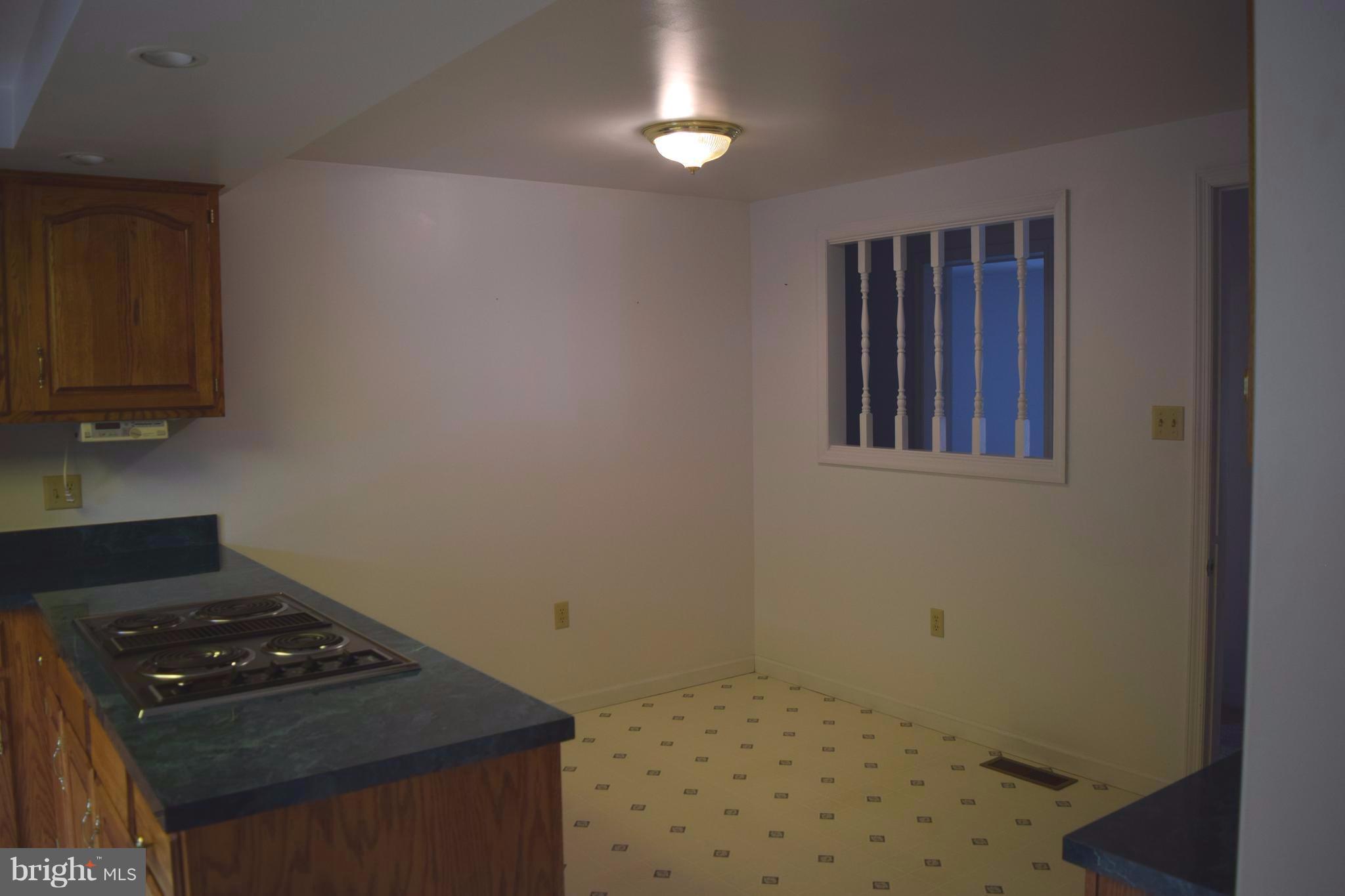 64 Cross Road Berkeley Springs, WV 25411 - Photo 14 of 30 a bedroom with a stove and a cabinet