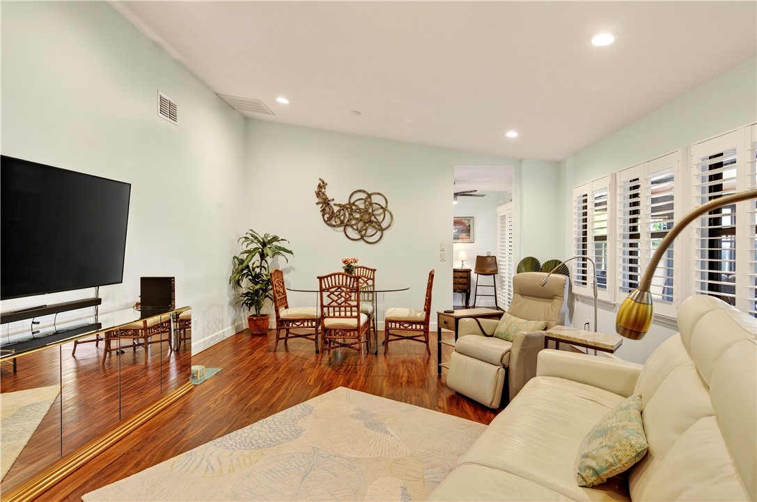 725 Timber Ridge Trail Southwest, Unit B Vero Beach, FL 32962 - Photo 11 of 36 a living room with furniture and a flat screen tv