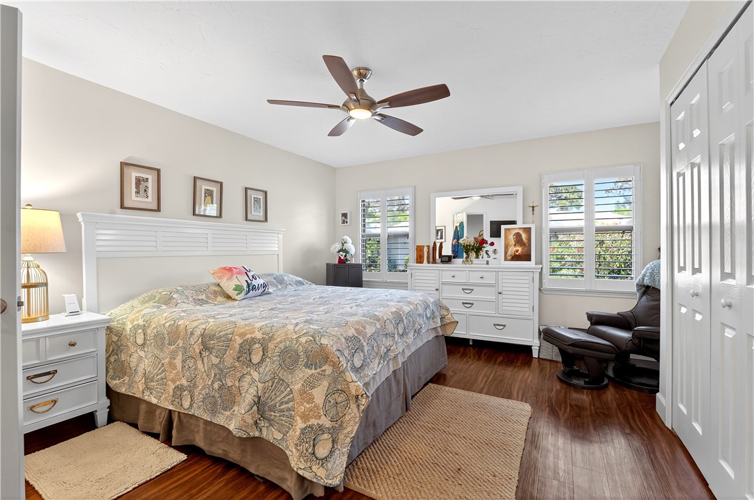 725 Timber Ridge Trail Southwest, Unit B Vero Beach, FL 32962 - Photo 11 of 27 a bedroom with bed and wooden floor