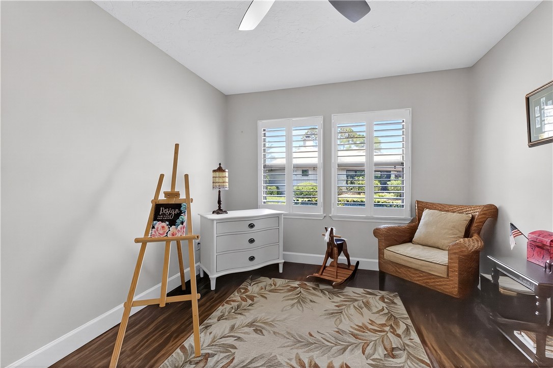 725 Timber Ridge Trail Southwest, Unit B Vero Beach, FL 32962 - Photo 25 of 36 a bed room with furniture and a window