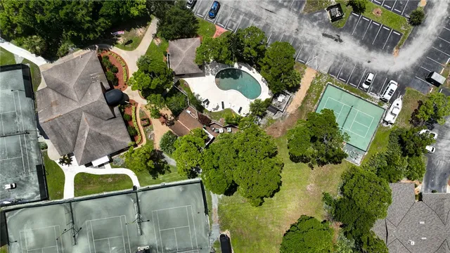 an aerial view of a house with a yard and garden