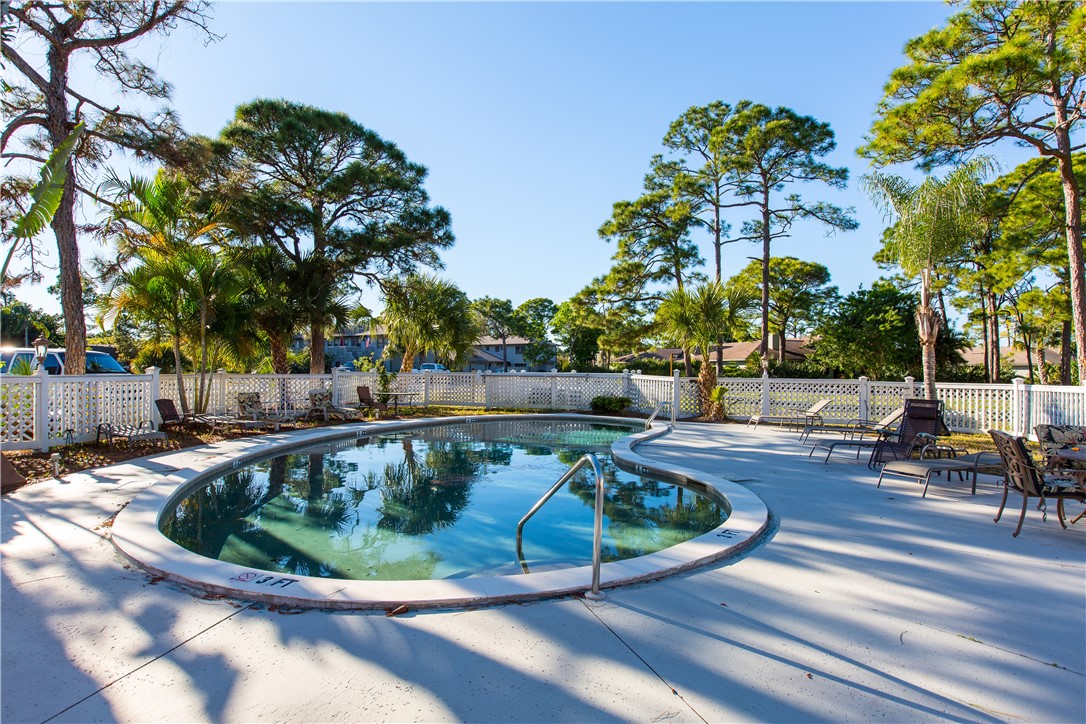 725 Timber Ridge Trail Southwest, Unit B Vero Beach, FL 32962 - Photo 5 of 27 a view of a swimming pool with sitting area