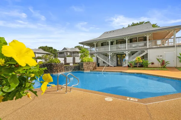 a view of swimming pool with outdoor seating and city view