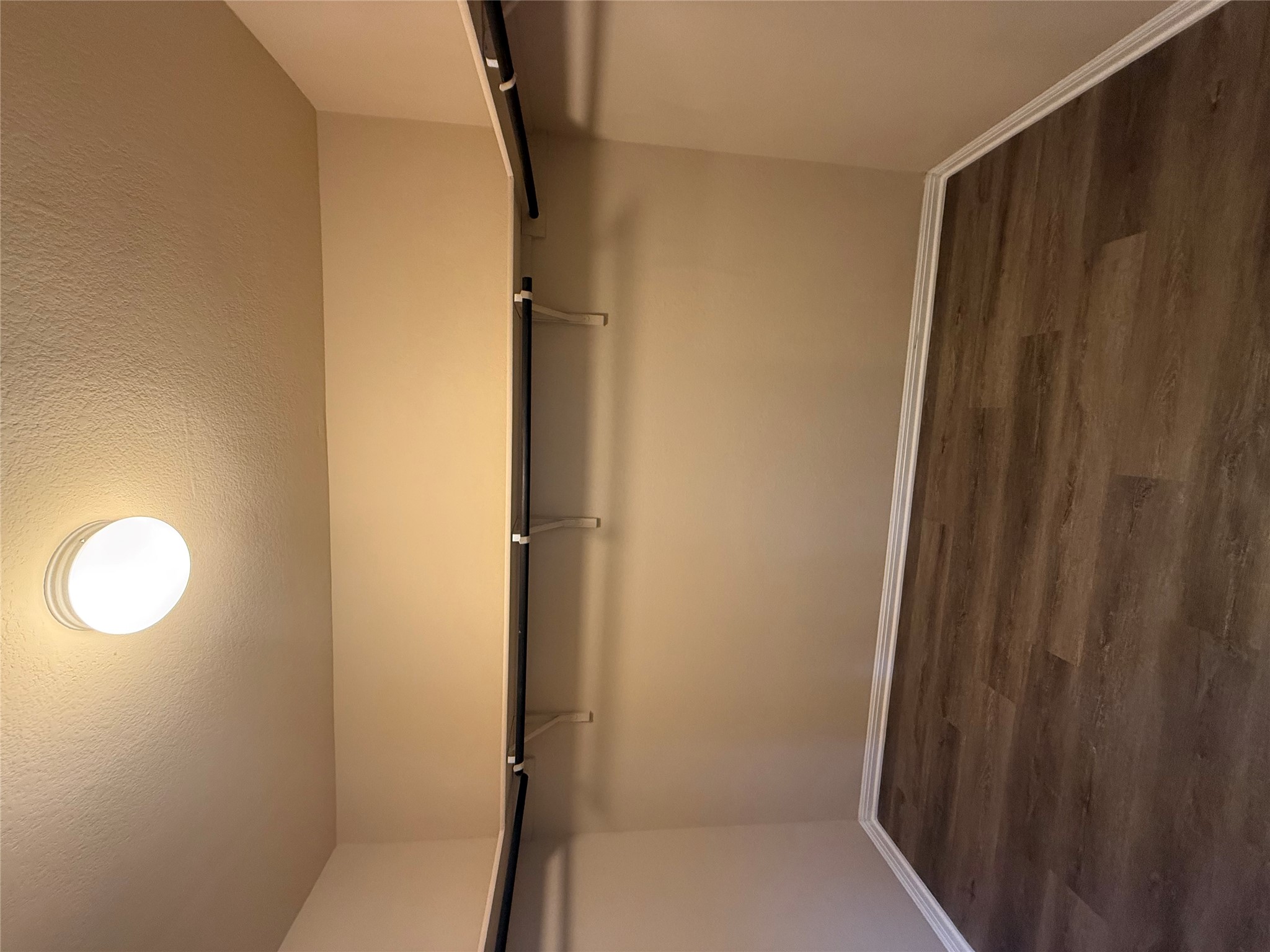 1441 Hamiltons Way Leander, TX 78641 - Photo 19 of 20 Walk in closet featuring dark wood finished floors
