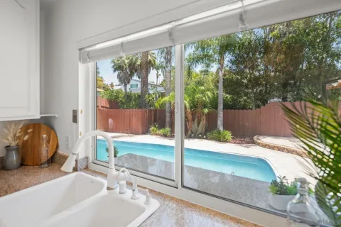 a kitchen that has a sink and a stove