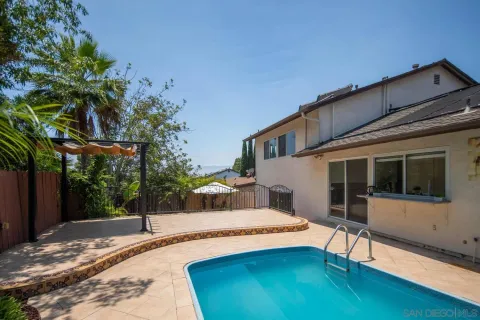 a house view with a backyard space