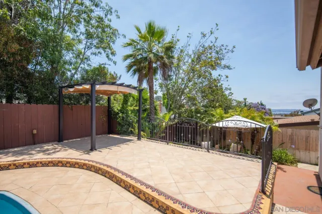 a view of a backyard with a patio