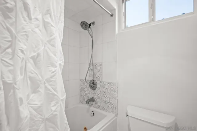 a view of a street with cars on road