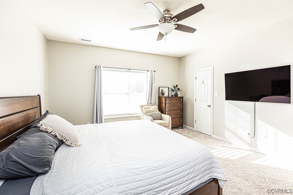 11100 Avening Road Midlothian, VA 23112 - Photo 14 of 29 a bedroom with a bed and a flat screen tv