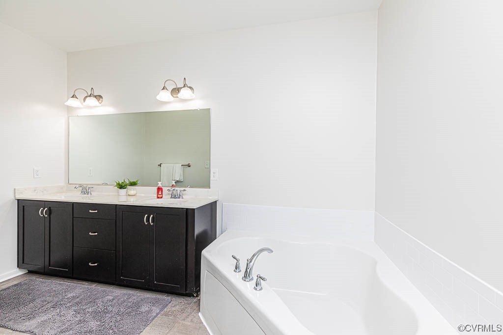11100 Avening Road Midlothian, VA 23112 - Photo 15 of 29 a bathroom with a tub sink and mirror