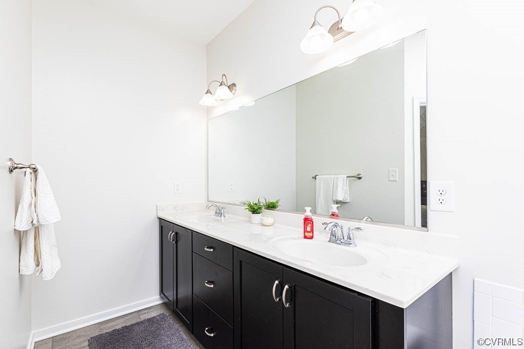 11100 Avening Road Midlothian, VA 23112 - Photo 17 of 29 a bathroom with a sink vanity and a mirror