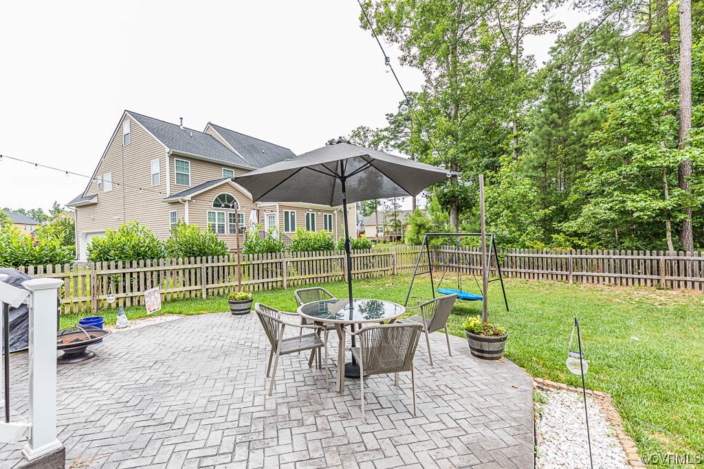 11100 Avening Road Midlothian, VA 23112 - Photo 26 of 29 a view of a deck with a chair and table
