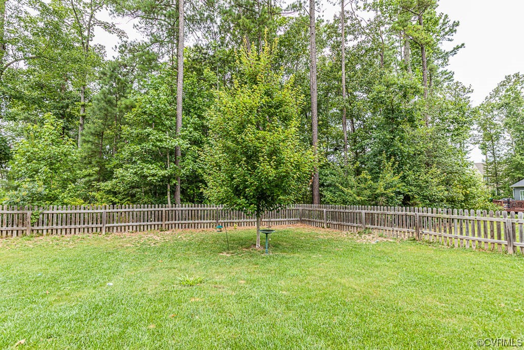 11100 Avening Road Midlothian, VA 23112 - Photo 28 of 29 a view of a yard with a wooden fence