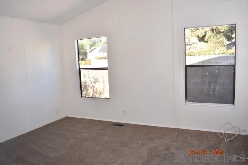 2515 Sweetwater Road, Unit 81 Spring Valley, CA 91977 - Photo 11 of 24 an empty room with windows