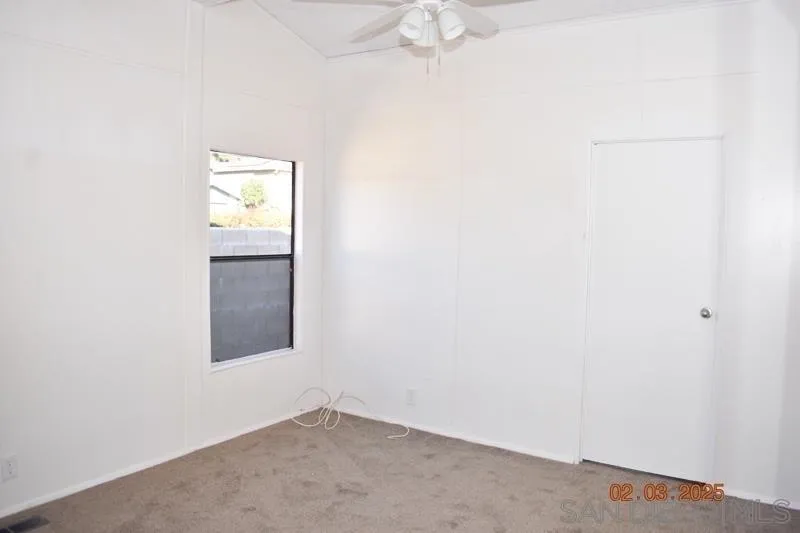 2515 Sweetwater Road, Unit 81 Spring Valley, CA 91977 - Photo 13 of 24 an empty room with a window
