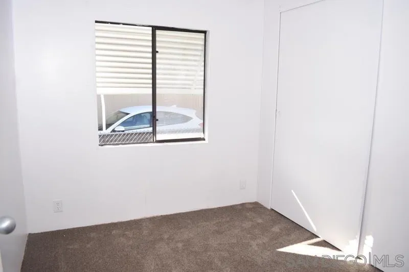2515 Sweetwater Road, Unit 81 Spring Valley, CA 91977 - Photo 14 of 24 an empty room with a window