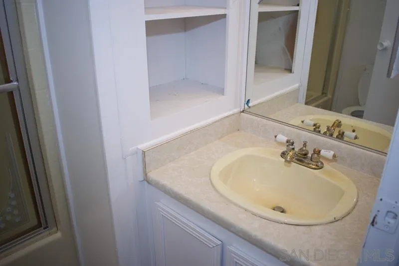 2515 Sweetwater Road, Unit 81 Spring Valley, CA 91977 - Photo 16 of 24 a bathroom with a sink and a mirror
