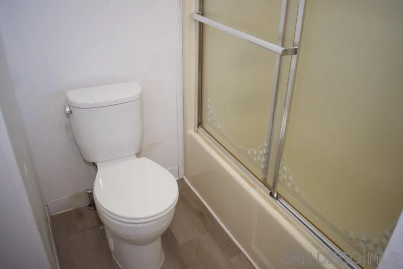 2515 Sweetwater Road, Unit 81 Spring Valley, CA 91977 - Photo 17 of 24 a white toilet sitting next to a shower