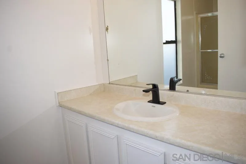 2515 Sweetwater Road, Unit 81 Spring Valley, CA 91977 - Photo 18 of 24 a bathroom with a sink and a mirror