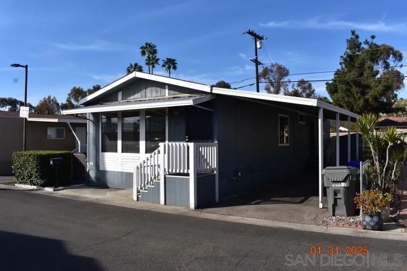 2515 Sweetwater Road, Unit 81 Spring Valley, CA 91977 - Photo 24 of 24 a front view of a house with a yard