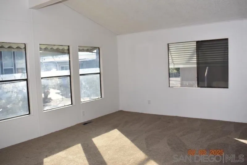 2515 Sweetwater Road, Unit 81 Spring Valley, CA 91977 - Photo 5 of 24 a view of an empty room with a window