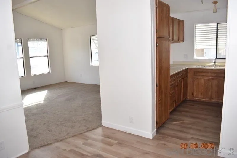 2515 Sweetwater Road, Unit 81 Spring Valley, CA 91977 - Photo 9 of 24 an empty room with windows and closet