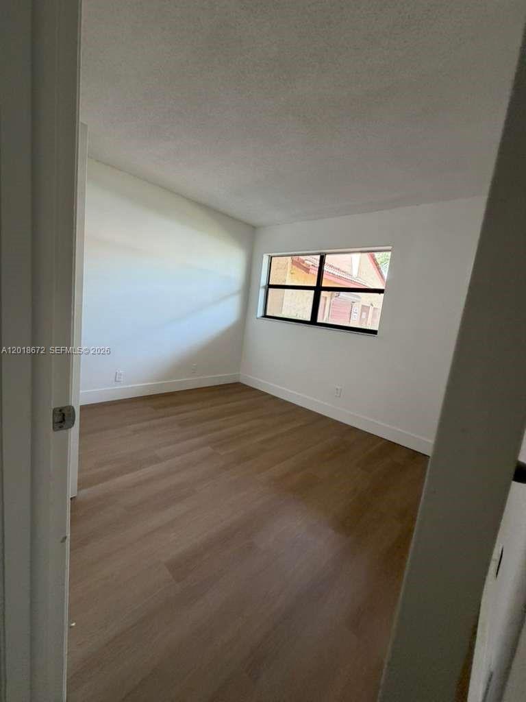 3400 Foxcroft Road, Unit 107 Miramar, FL 33025 - Photo 14 of 15 an empty room with windows