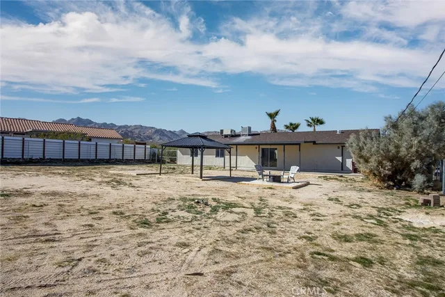 a view of a house with a snow on the road