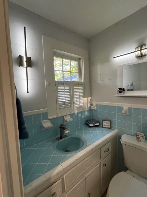 1386 Chisholm Road Cypress Inn, TN 38452 - Photo 47 of 58 a bathroom with a granite countertop sink and a mirror