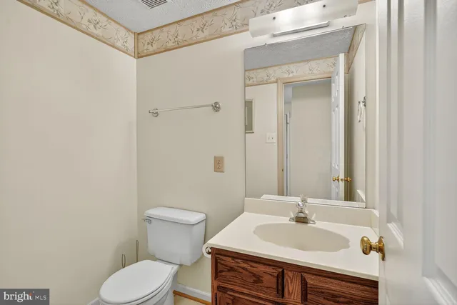 a view of a patio with table and chairs with wooden floor and fence