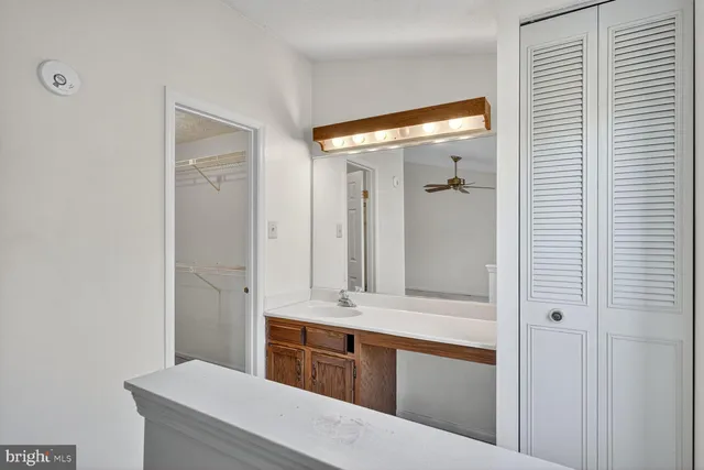a bathroom with a bathtub and a double vanity sink
