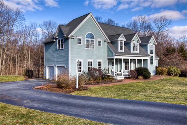 2 Split Rock Lane Hopkinton, MA 01748 - Photo 1 of 30 a front view of a house with a yard table and chairs