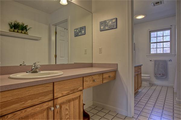 2 Split Rock Lane Hopkinton, MA 01748 - Photo 22 of 30 a bathroom with a sink a toilet and a mirror