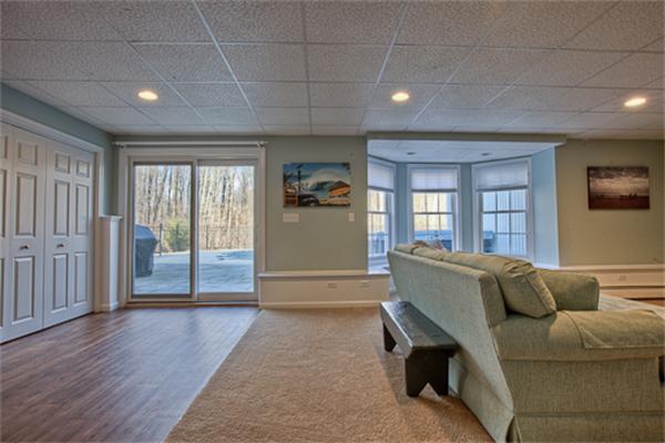 2 Split Rock Lane Hopkinton, MA 01748 - Photo 26 of 30 a living room with furniture and a flat screen tv