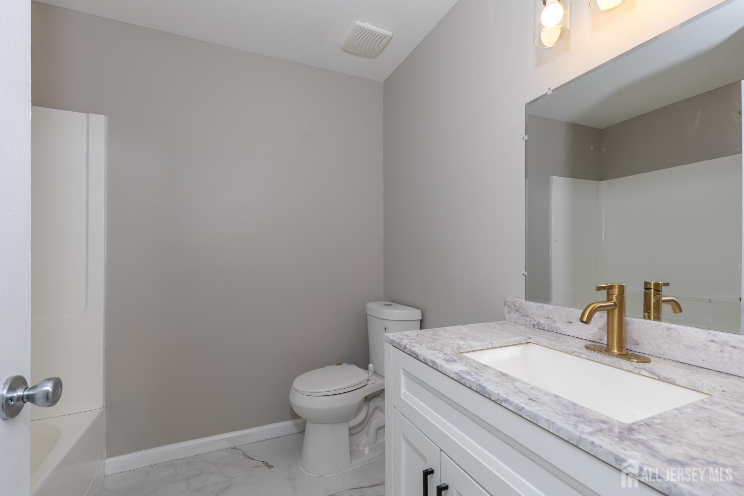 2301 Bayhead Drive Parlin, NJ 08859 - Photo 13 of 18 a bathroom with a granite countertop toilet and sink
