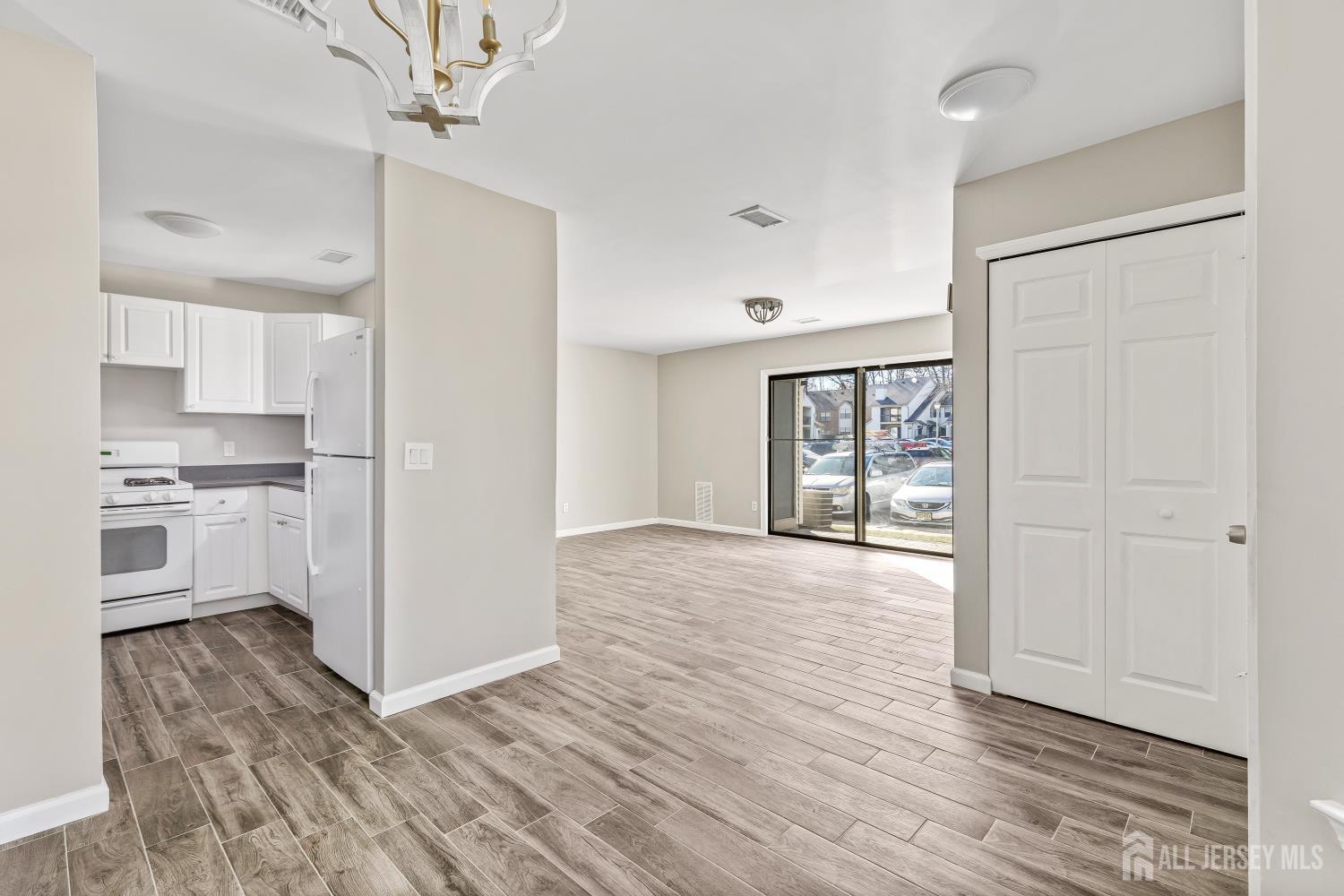 2301 Bayhead Drive Parlin, NJ 08859 - Photo 10 of 18 a view of a kitchen with wooden floor and a sink