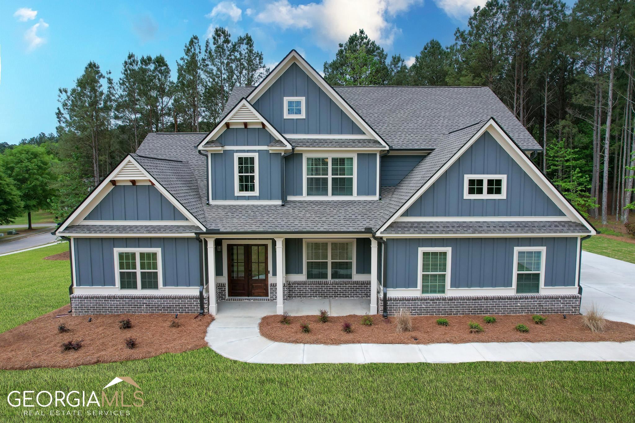 a front view of a house with a yard