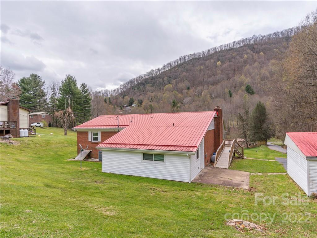 80 Stewart Road Waynesville, NC 28786 - Photo 19 of 22 an aerial view of residential houses with outdoor space and trees