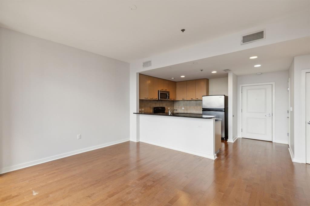 1200 Main Street, Unit 2302 Dallas, TX 75202 - Photo 9 of 22 a view of kitchen with wooden floor