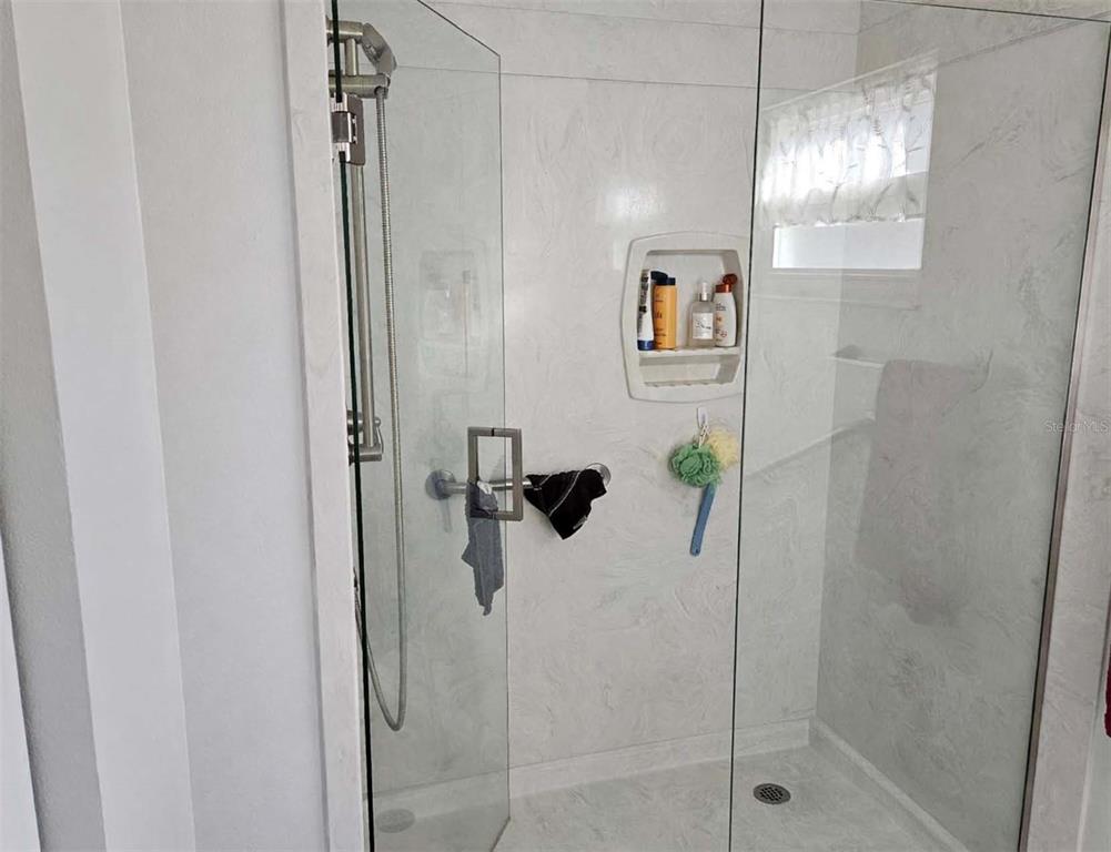 8480 Southwest 61st Terrace Road Ocala, FL 34476 - Photo 16 of 26 a bathroom with a shower