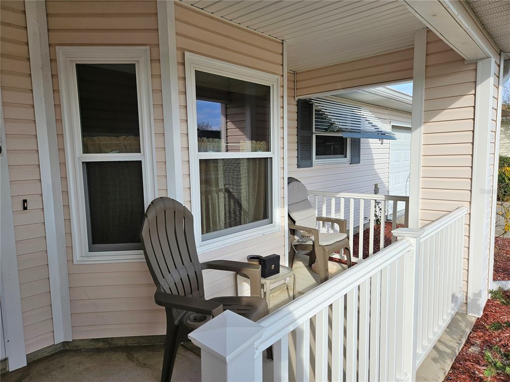 8480 Southwest 61st Terrace Road Ocala, FL 34476 - Photo 2 of 26 a view of a balcony with furniture