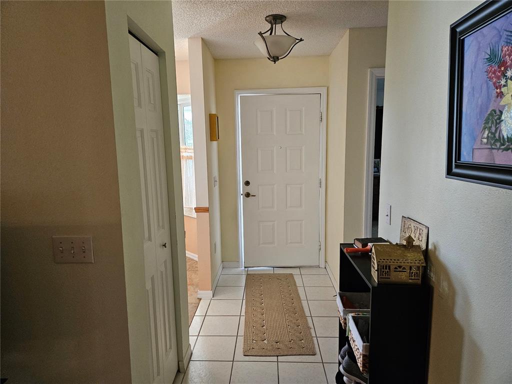 8480 Southwest 61st Terrace Road Ocala, FL 34476 - Photo 3 of 26 a view of a hallway with front door