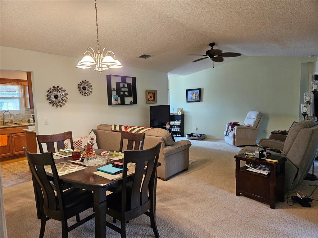8480 Southwest 61st Terrace Road Ocala, FL 34476 - Photo 8 of 26 a view of a dining room with furniture