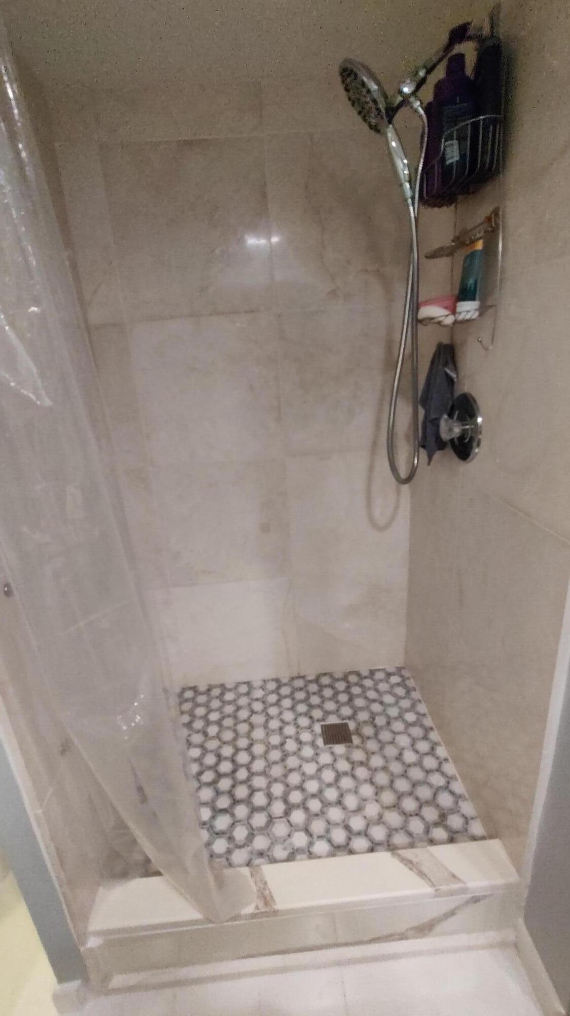 5646 Southeast Windsong Lane, Unit 415 Stuart, FL 34997 - Photo 11 of 20 a bathroom with a shower