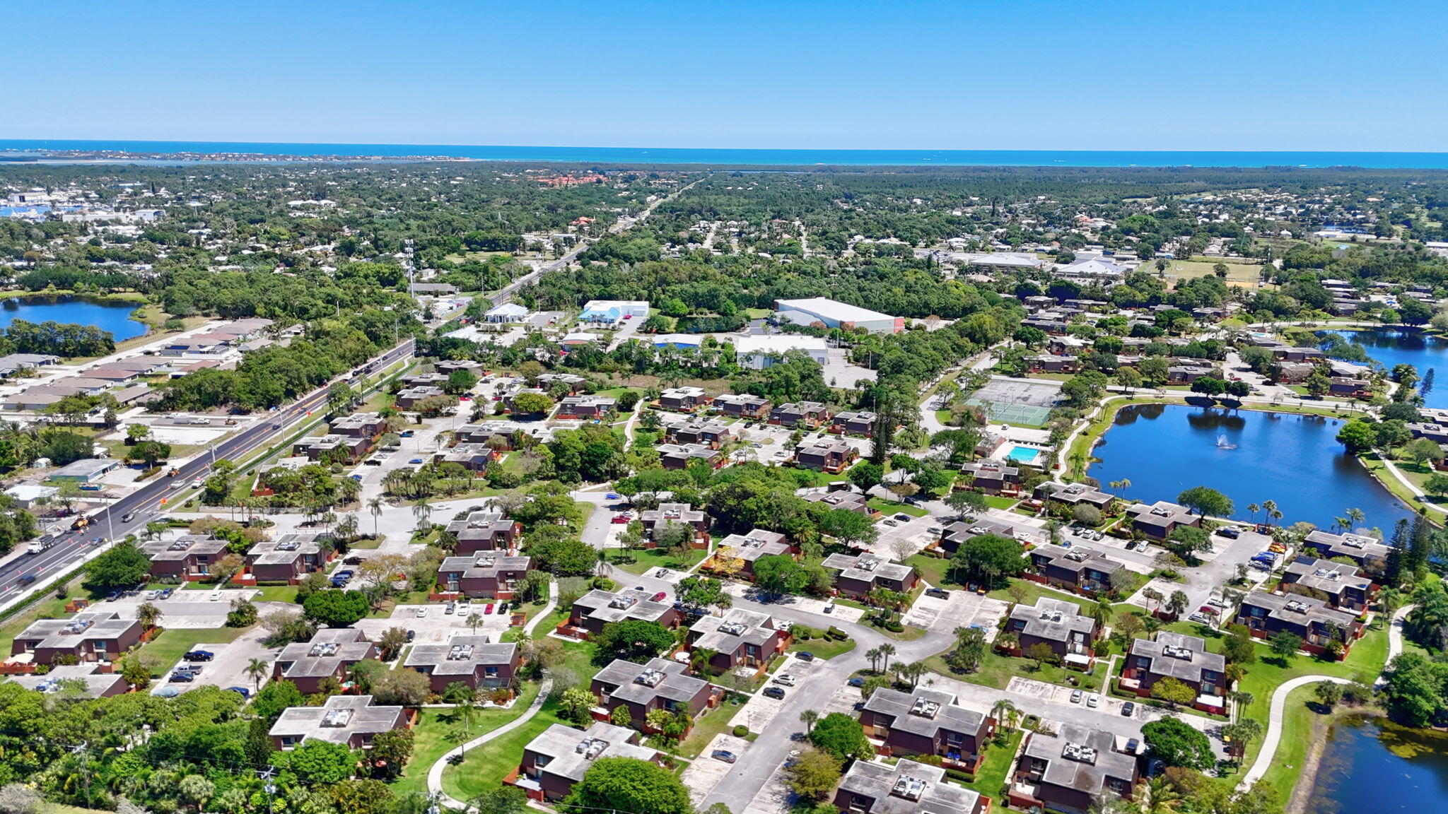 5646 Southeast Windsong Lane, Unit 415 Stuart, FL 34997 - Photo 19 of 20 an aerial view of multiple house