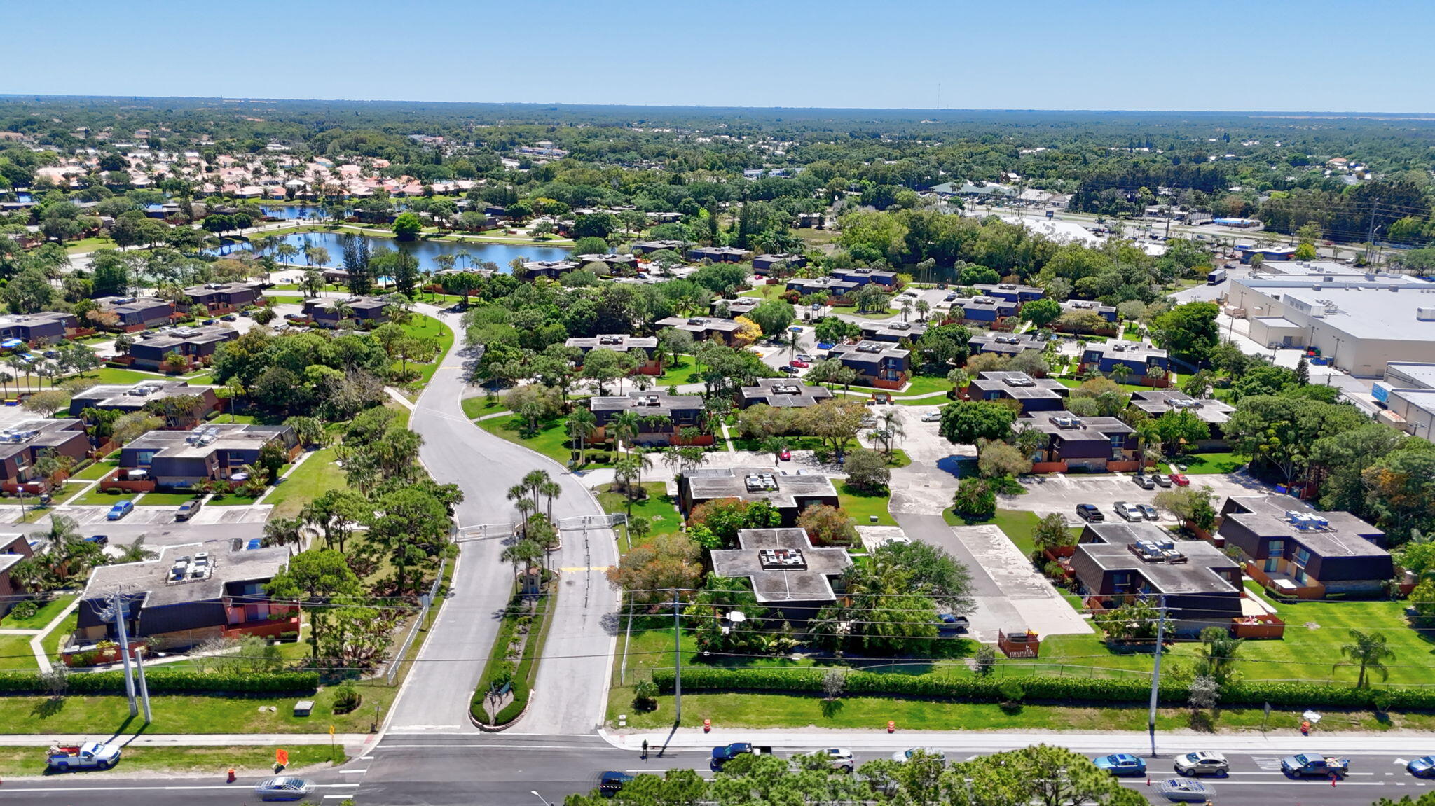 5646 Southeast Windsong Lane, Unit 415 Stuart, FL 34997 - Photo 20 of 20 an aerial view of a city with lots of residential buildings