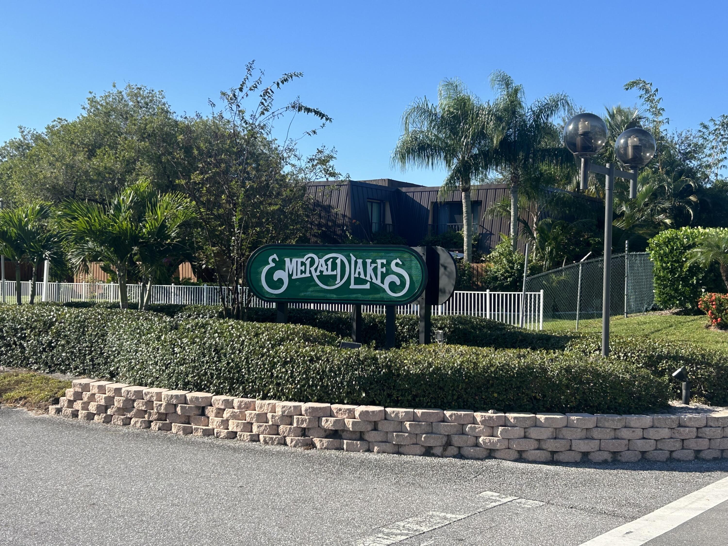 5646 Southeast Windsong Lane, Unit 415 Stuart, FL 34997 - Photo 2 of 20 a view of a street sign