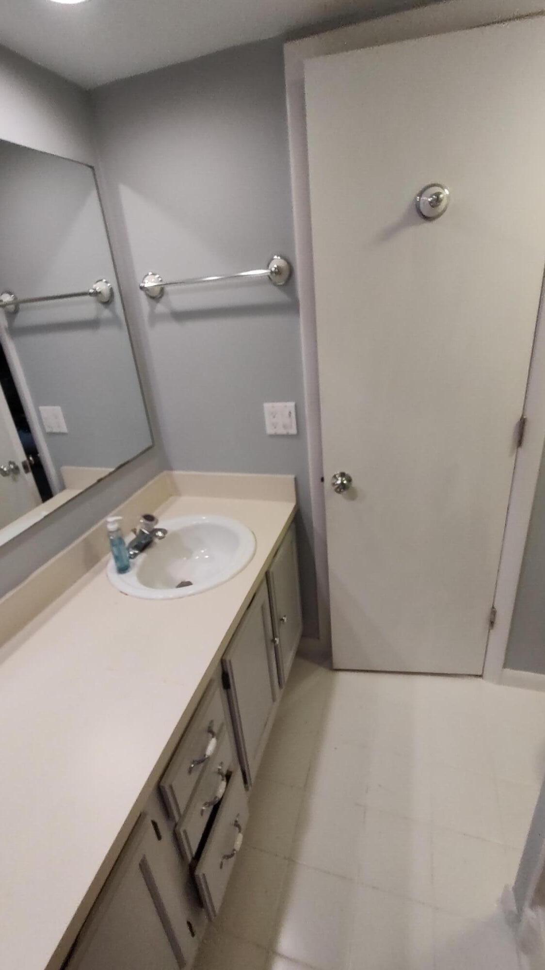 5646 Southeast Windsong Lane, Unit 415 Stuart, FL 34997 - Photo 10 of 20 a utility room with dryer and washer