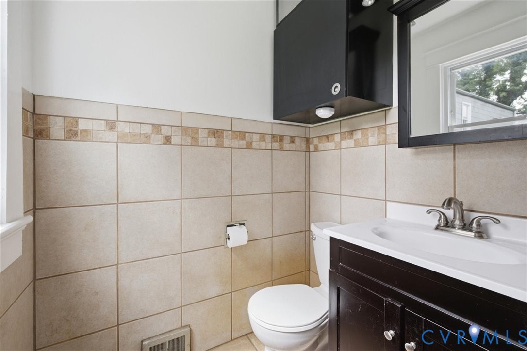 7232 Hopkins Road North Chesterfield, VA 23237 - Photo 14 of 34 Tile wainscoting with a decorative accent band, da