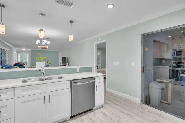 a kitchen with a sink stove and refrigerator